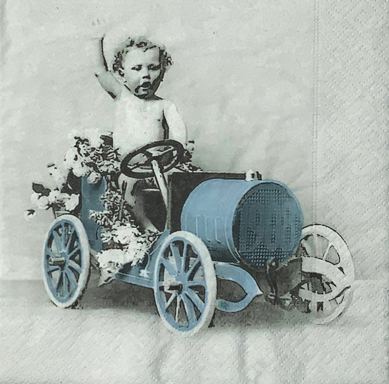 Boy driving a vintage car